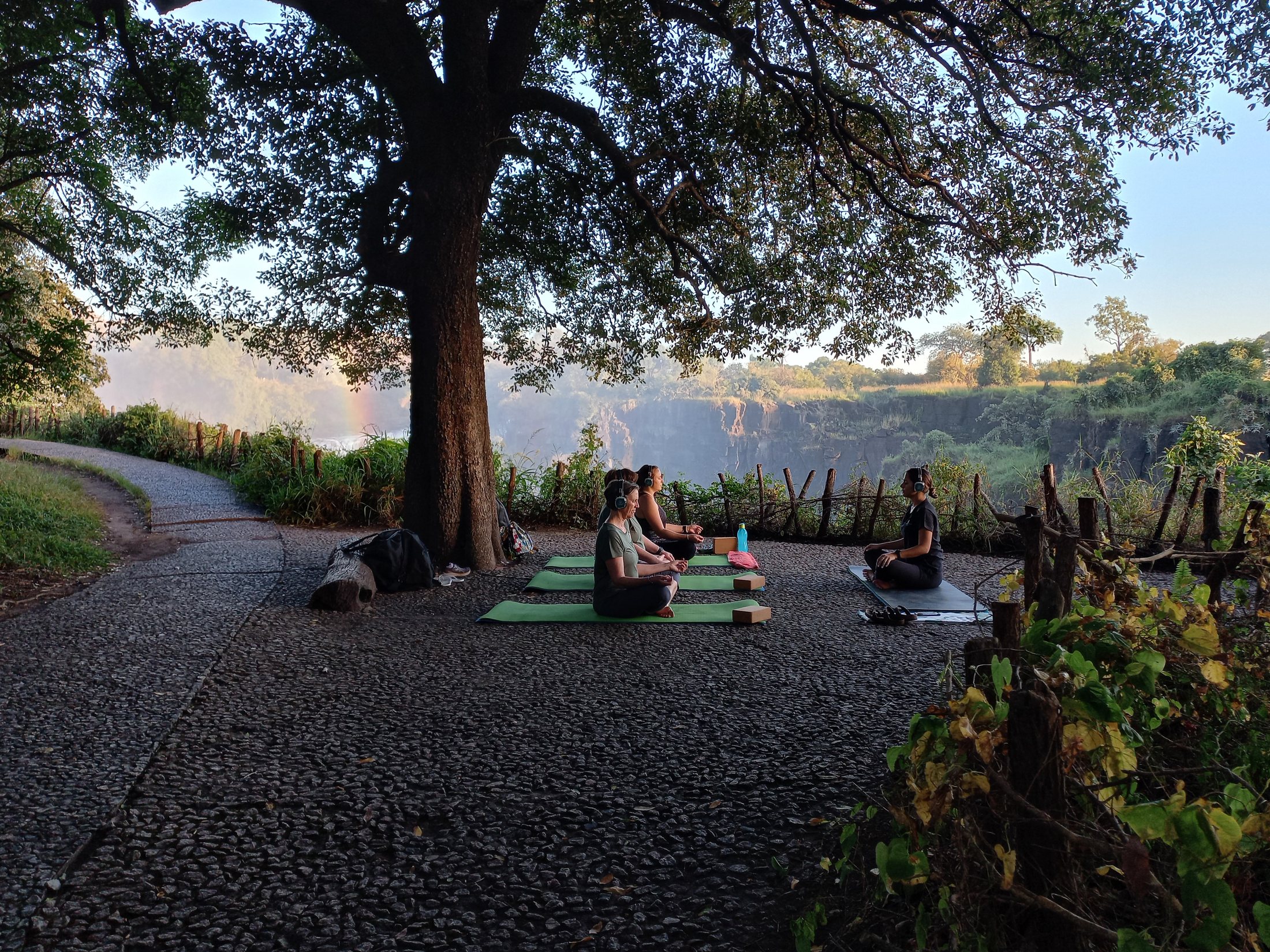 Solo warrior pose overlooking Victoria Falls