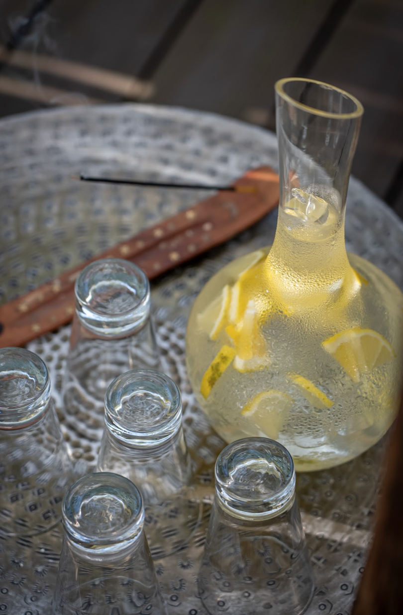 Chilled lemonade and glasses on a lodge table