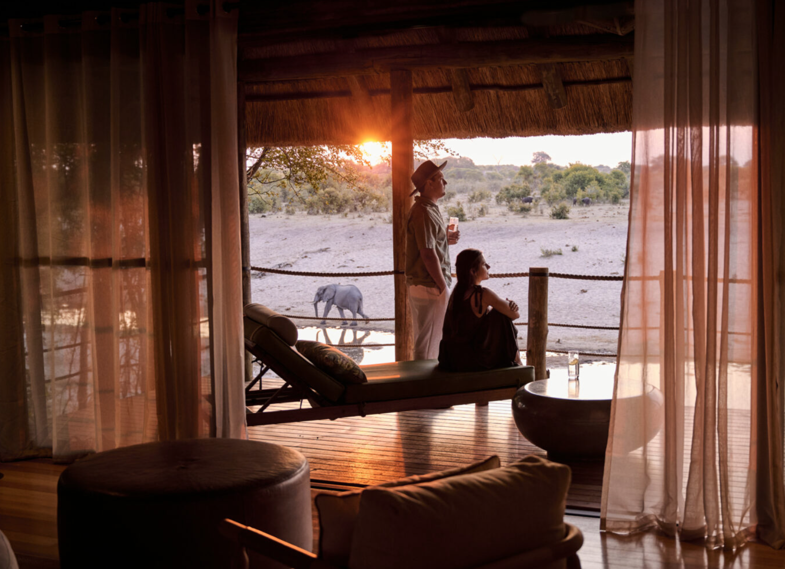 Kerrith O'Fee and Shaun Read watching elephants at sunset